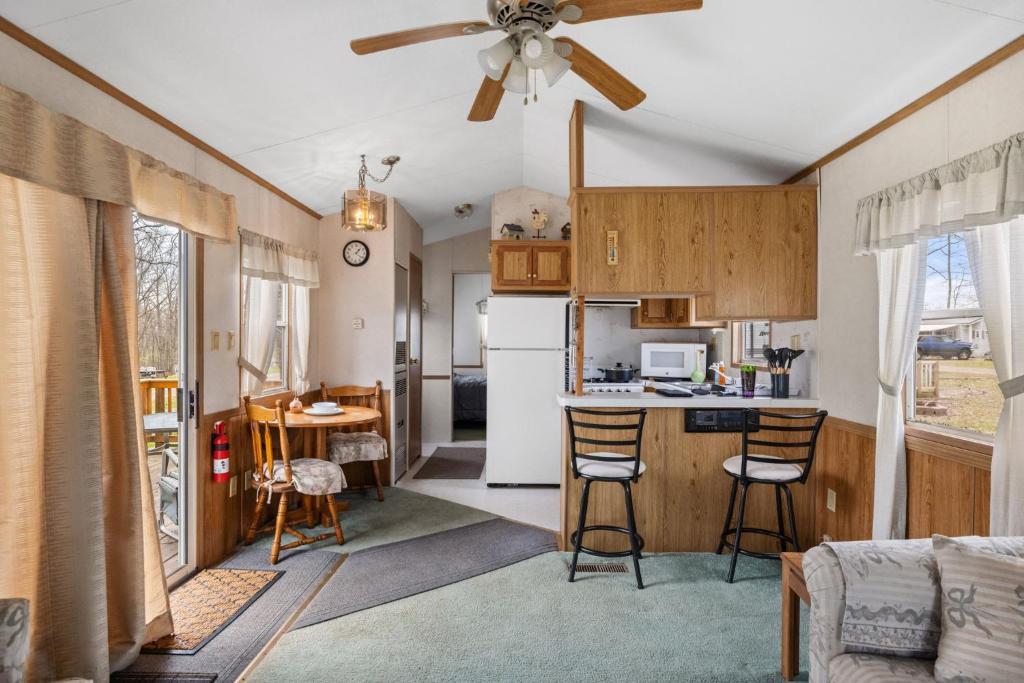 a kitchen with a white refrigerator and a counter at Casa Villa Park 91 in Russell