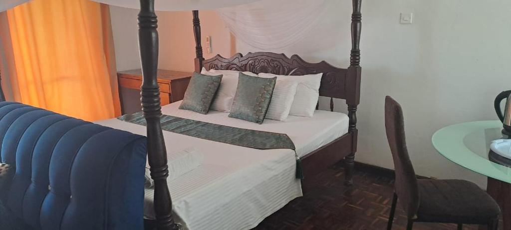 Postel nebo postele na pokoji v ubytování Karibu homestay-nyali