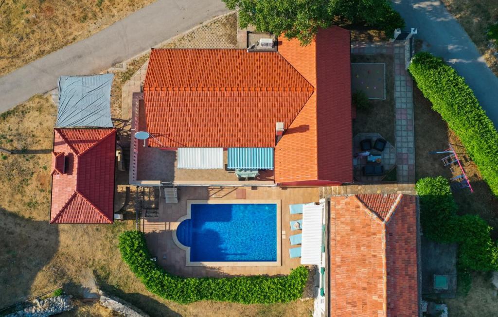 an overhead view of a house with a swimming pool at Villa Bilanzic - Omis by Villas Guide in Kreševo