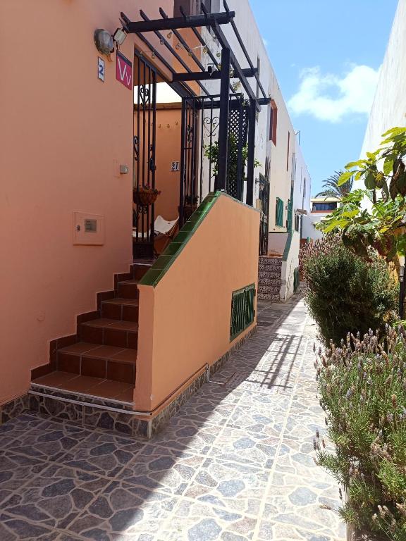a stairway leading up to a building with a gate at Bellavista Basement in Costa Del Silencio