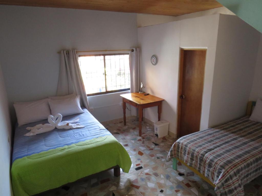 Postel nebo postele na pokoji v ubytování Hotel Casita de Belén
