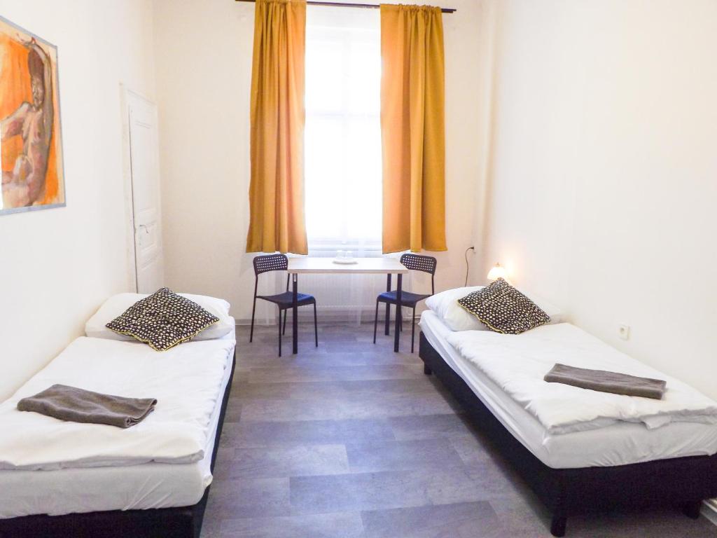 Postel nebo postele na pokoji v ubytování Pokoj v Pražských Holešovicích C1