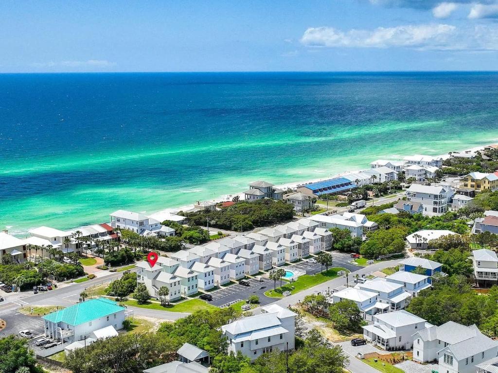 an aerial view of a resort near the ocean at Barefoot Breeze,Steps To The Beach ,Pool ,Sleeps 13, Seacrest in Seacrest