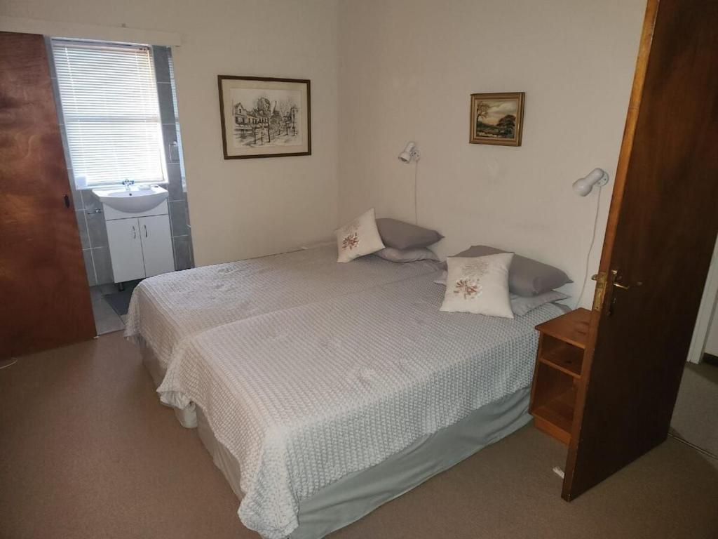 Postel nebo postele na pokoji v ubytování Fairway Corner