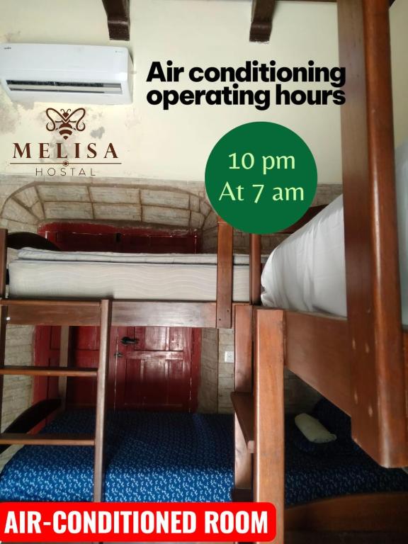 Postel nebo postele na pokoji v ubytování MELISA HOSTAL