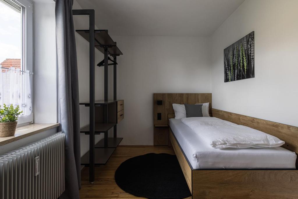 Postel nebo postele na pokoji v ubytování WORK N LIVE Fühl Dich zu Hause