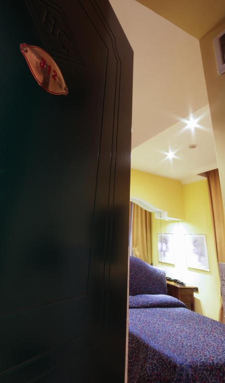 Cama ou camas em um quarto em Hotel Canova