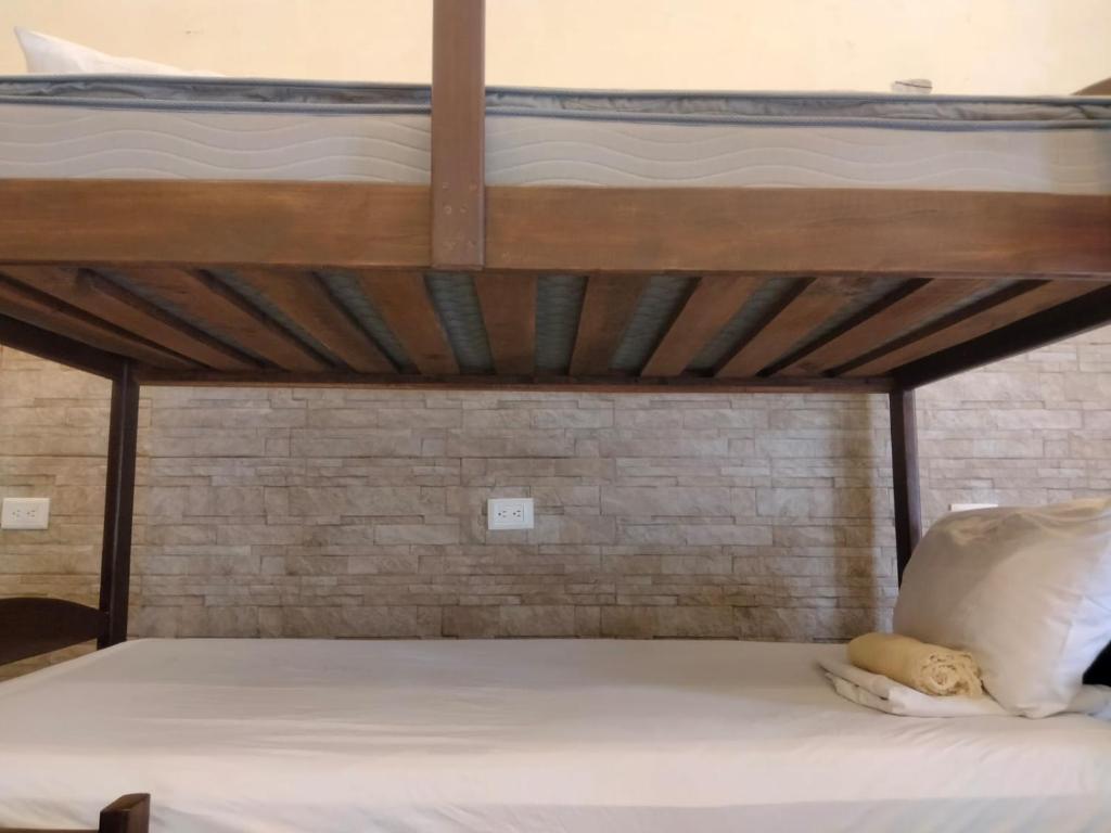 Postel nebo postele na pokoji v ubytování MELISA HOSTAL