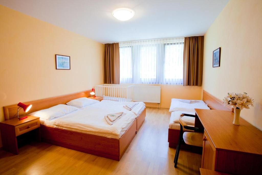 Postel nebo postele na pokoji v ubytování Motel Svatý Kryštof