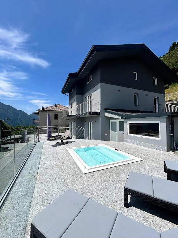 a house with a swimming pool on a patio at Villa Alisha Mountain View in Casargo