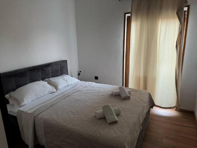a bedroom with a large bed with towels on it at Apartment Almira in Pula
