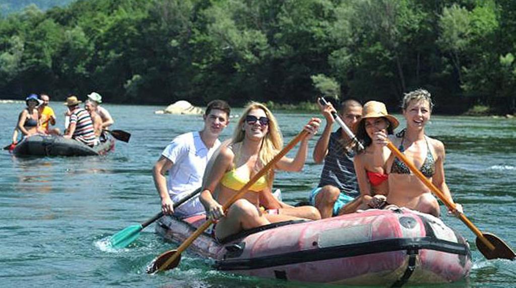 a group of people on a raft in the water at Hotel Royal Drina in Mali Zvornik