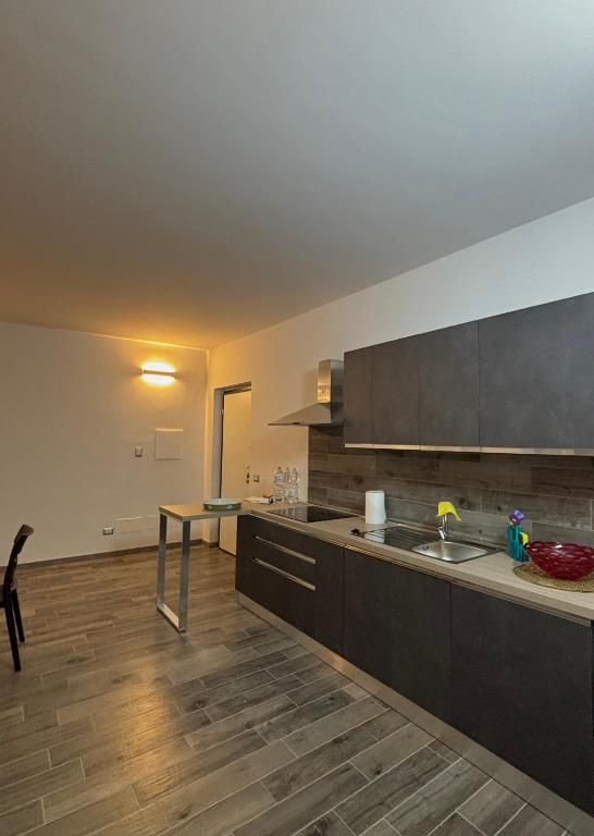 a kitchen with a sink and a counter top at Torvajanica Antonella in Torvaianica