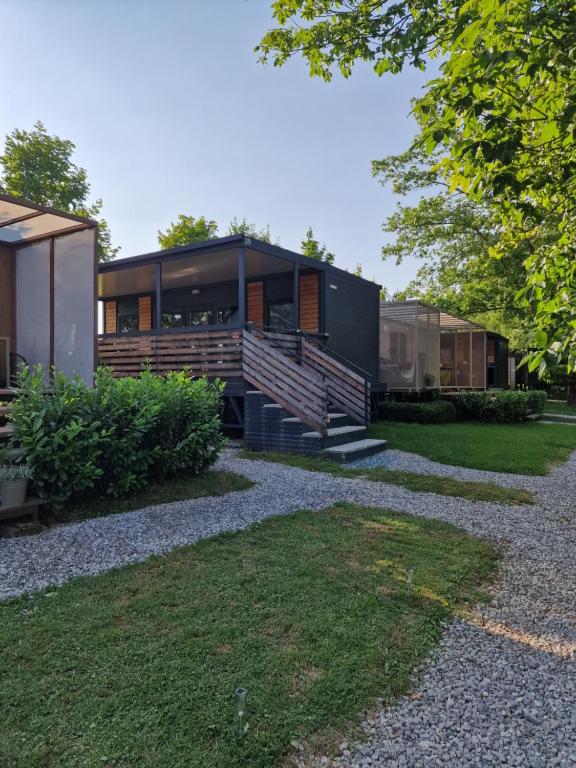 a modern house with a large front yard at Tavio mobile house Kolpa, BIG BERRY, Metlika in Metlika