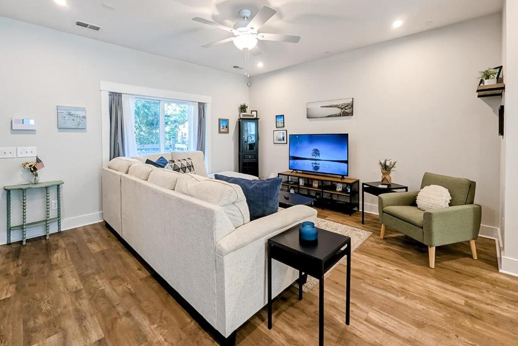 a living room with a couch and a tv at 4563 Summey in Charleston