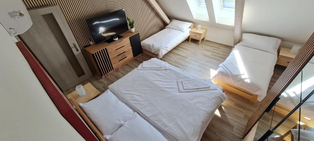 Postel nebo postele na pokoji v ubytování Apartmány Žireč