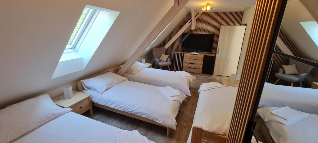 Postel nebo postele na pokoji v ubytování Apartmány Žireč