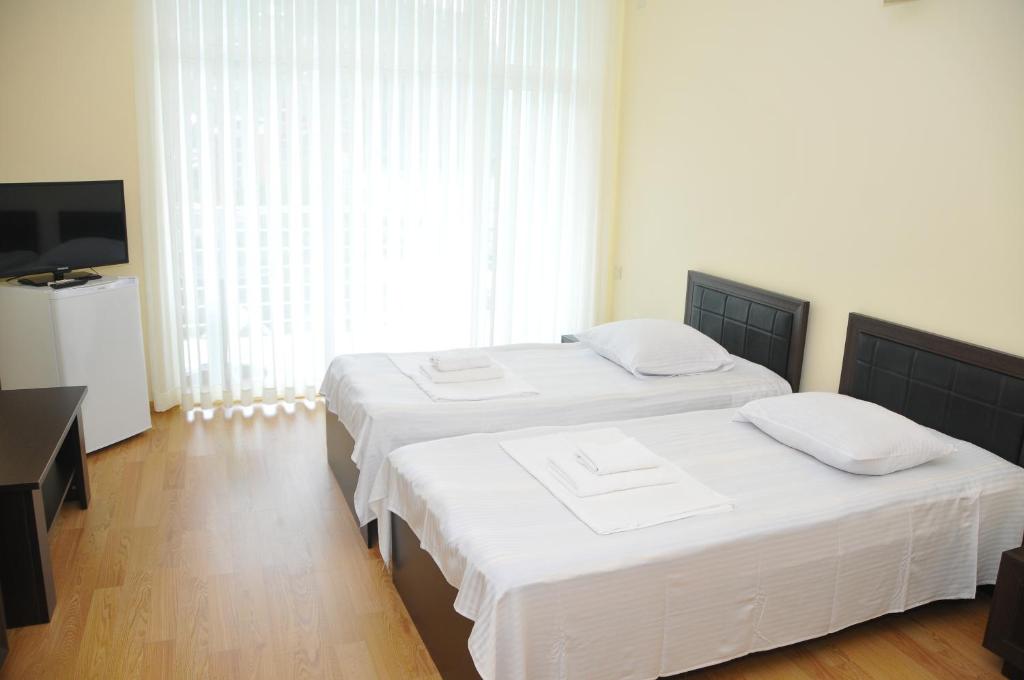 Postel nebo postele na pokoji v ubytování Black Sea Hotel