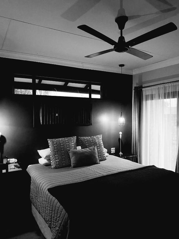 Ένα ή περισσότερα κρεβάτια σε δωμάτιο στο Phatt Olive BnB
