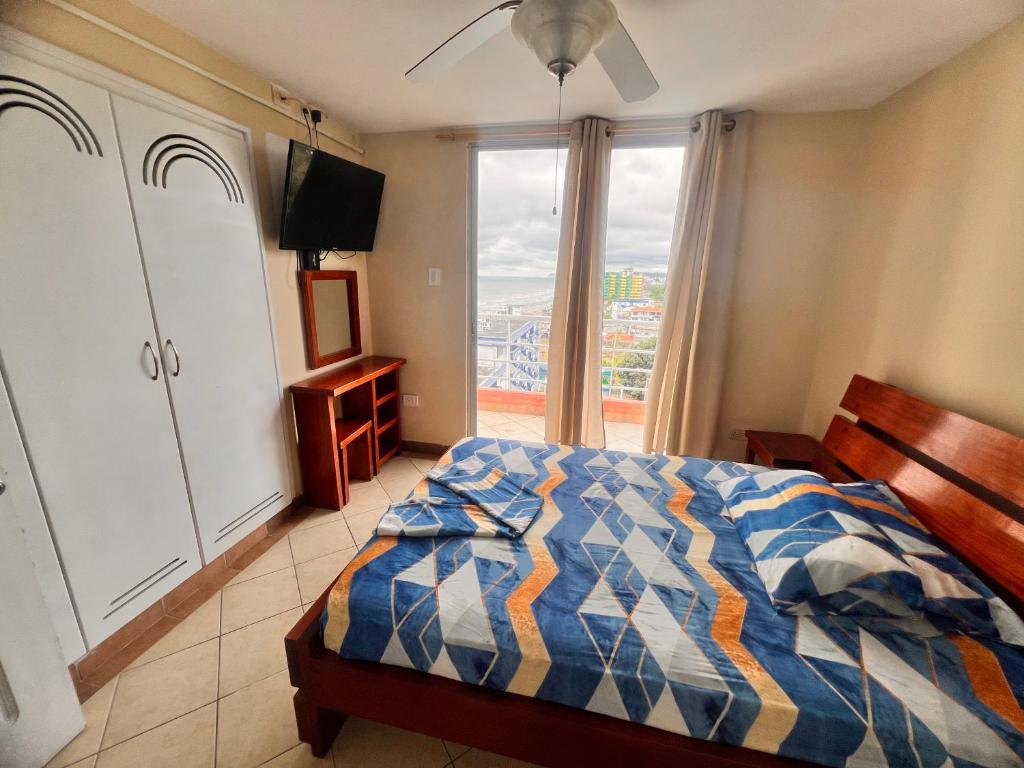 Postel nebo postele na pokoji v ubytování Arena y Mar Arco Iris