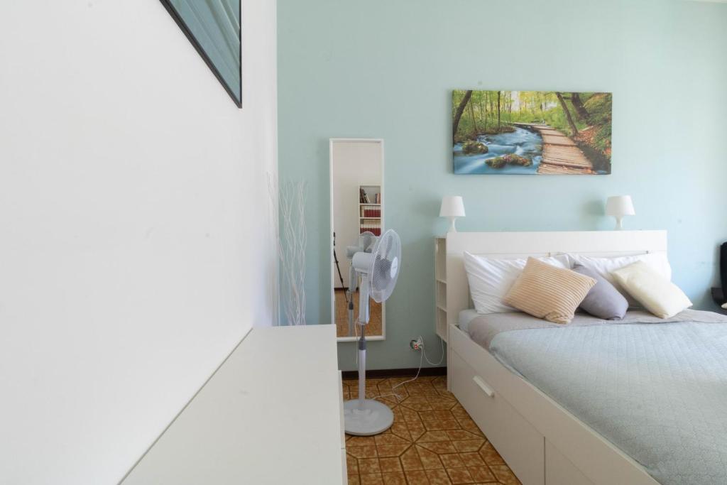 Postel nebo postele na pokoji v ubytování casa a colori