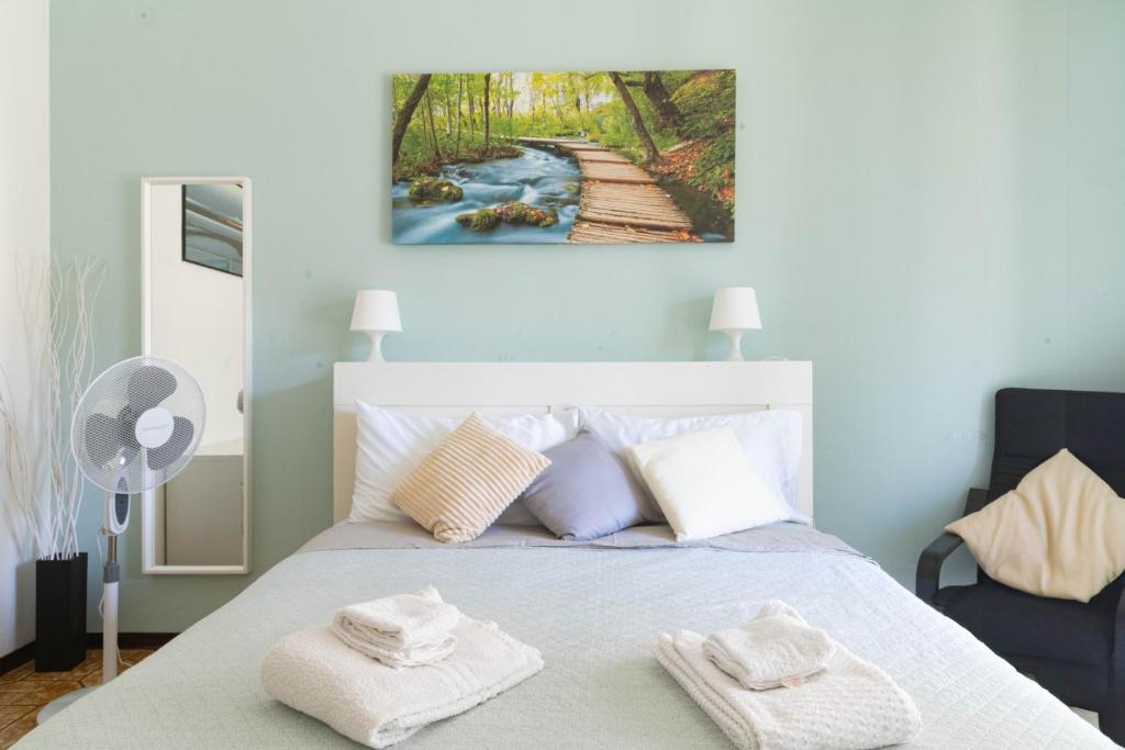 Postel nebo postele na pokoji v ubytování casa a colori