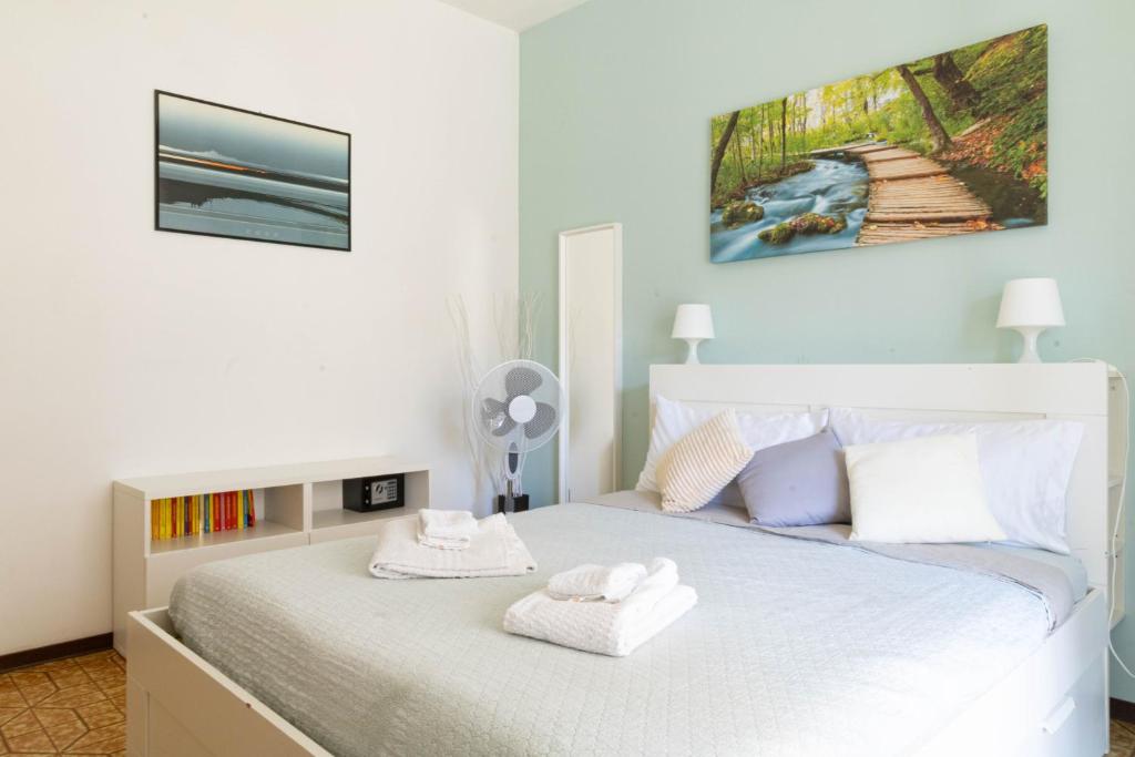 Postel nebo postele na pokoji v ubytování casa a colori