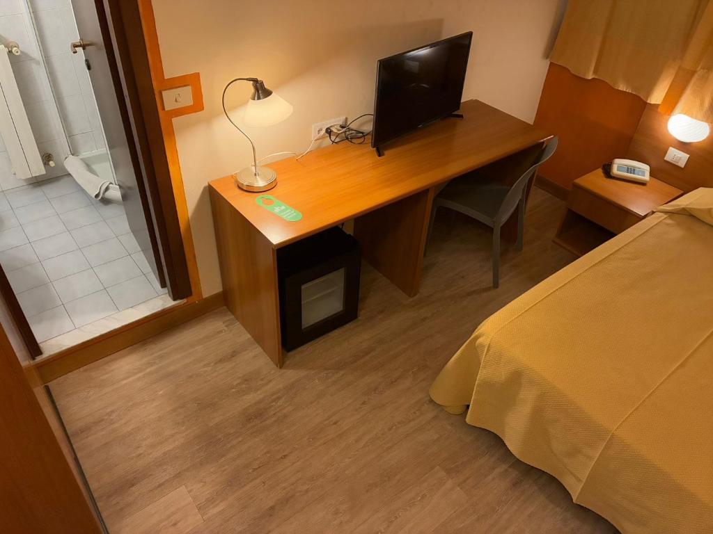Postel nebo postele na pokoji v ubytování Hotel Annunziata