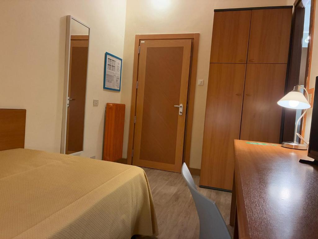 Postel nebo postele na pokoji v ubytování Hotel Annunziata