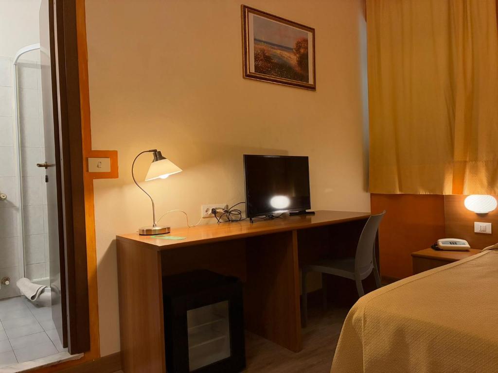 Postel nebo postele na pokoji v ubytování Hotel Annunziata