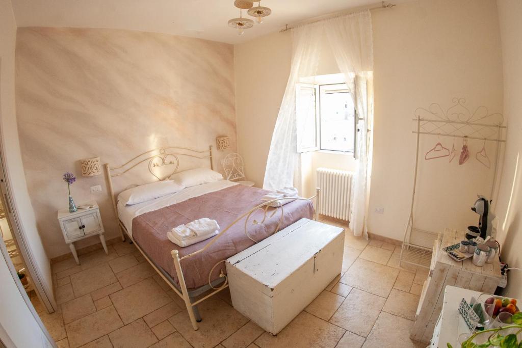 Postel nebo postele na pokoji v ubytování Lo splendore dei Sassi