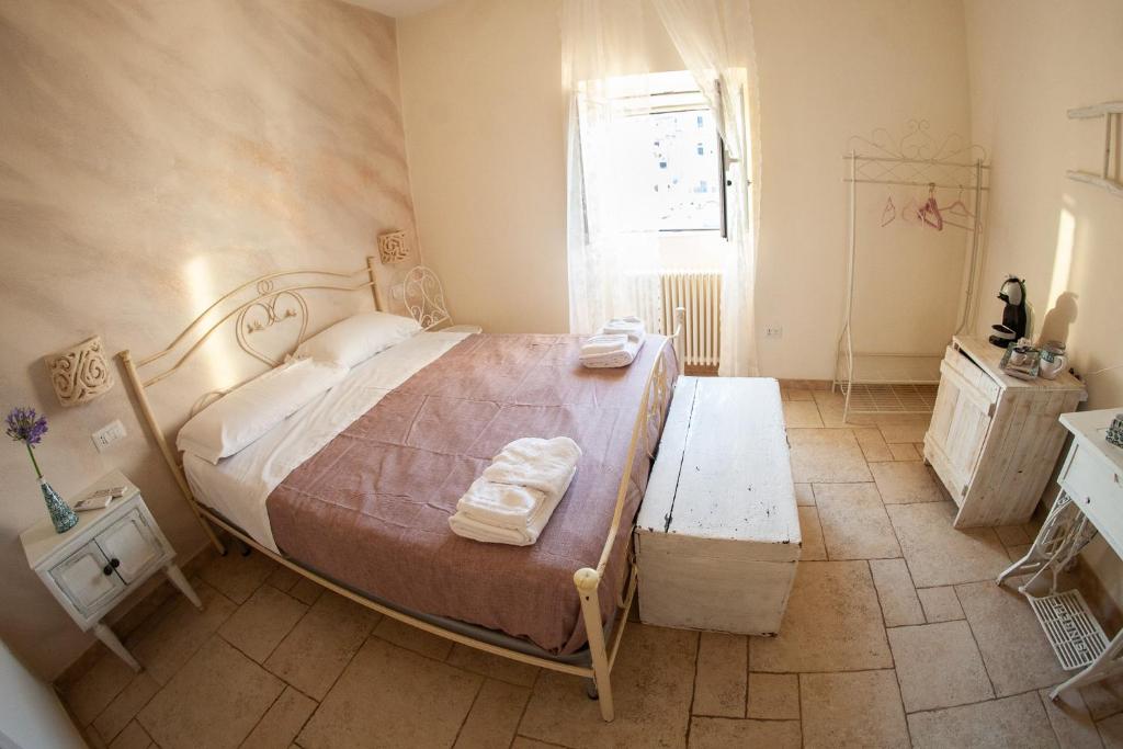 Postel nebo postele na pokoji v ubytování Lo splendore dei Sassi
