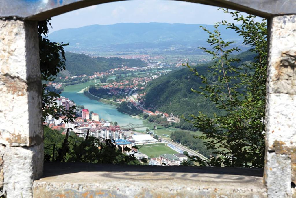 a view of a river from a window at Hotel Royal Drina in Mali Zvornik