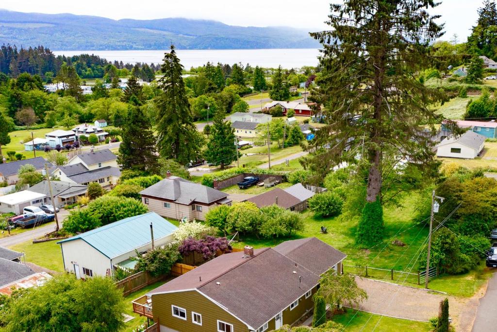 an aerial view of a small town with houses and a lake at Bonnie's Bayview Beach House in Bay City