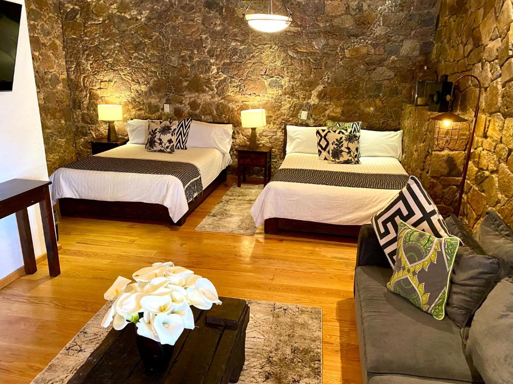 Postel nebo postele na pokoji v ubytování HOTEL MINA REAL