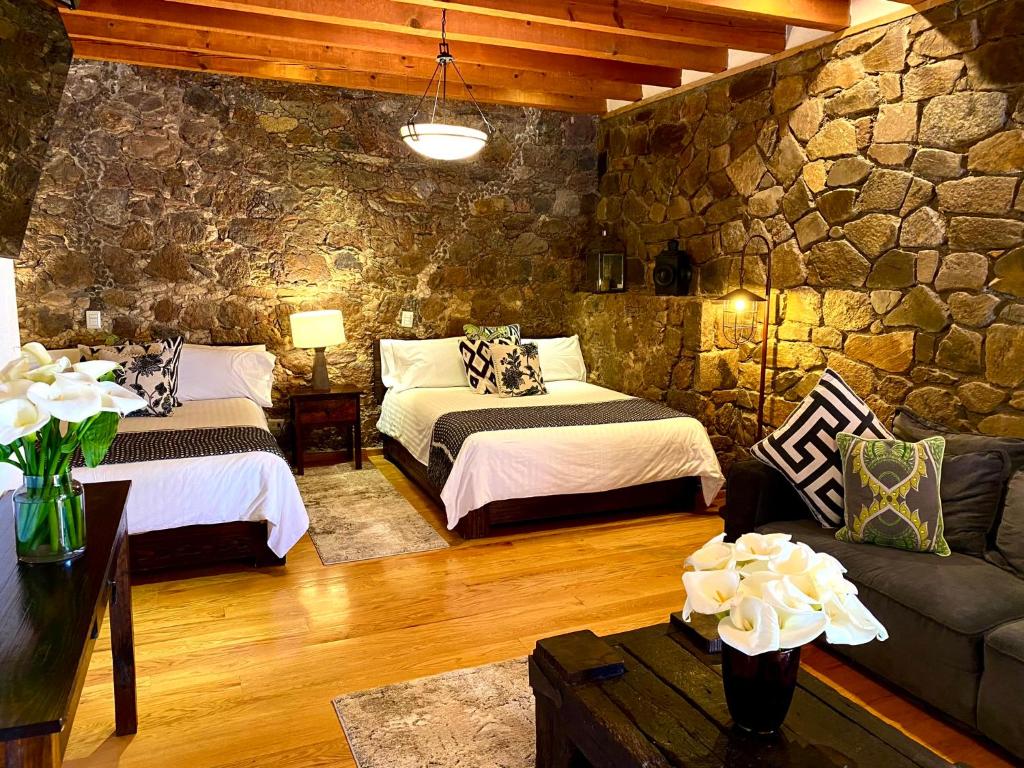 Postel nebo postele na pokoji v ubytování HOTEL MINA REAL