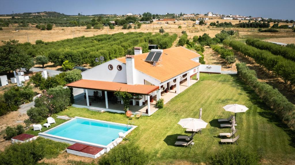 an aerial view of a villa with a swimming pool at Monte do Trancoso in Alvito