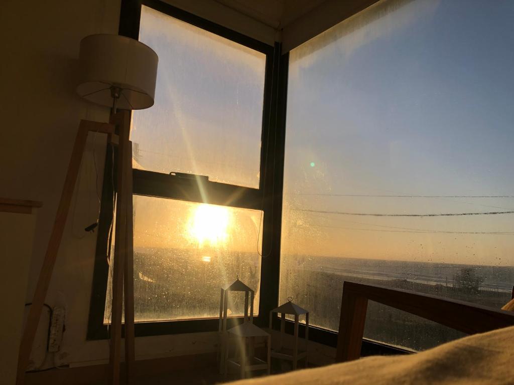 Solopgangen eller solnedgangen set fra lejligheden