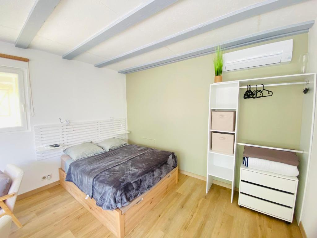 Postel nebo postele na pokoji v ubytování Studio Cosy, Rénové, Ecrin de calme & confort