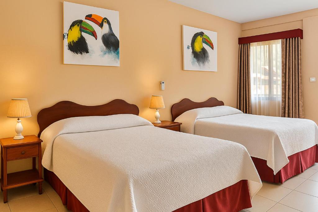 Postel nebo postele na pokoji v ubytování Hotel Divisamar by LHR