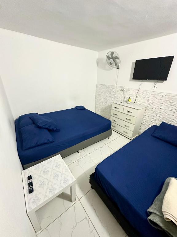 Postel nebo postele na pokoji v ubytování Hostal Campo Amor