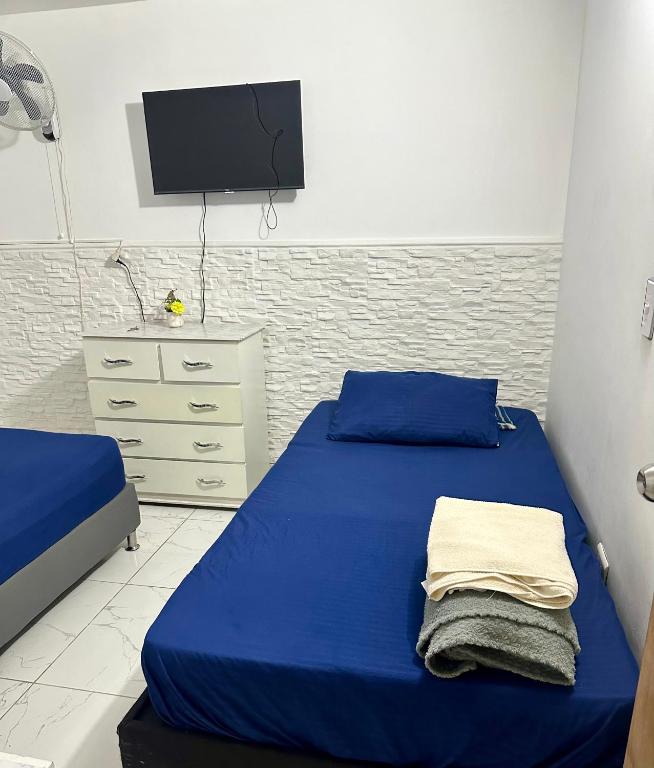 Postel nebo postele na pokoji v ubytování Hostal Campo Amor