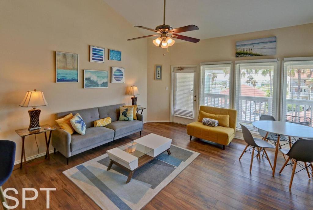 a living room with a couch and a table at Gulfpoint 1302 in South Padre Island
