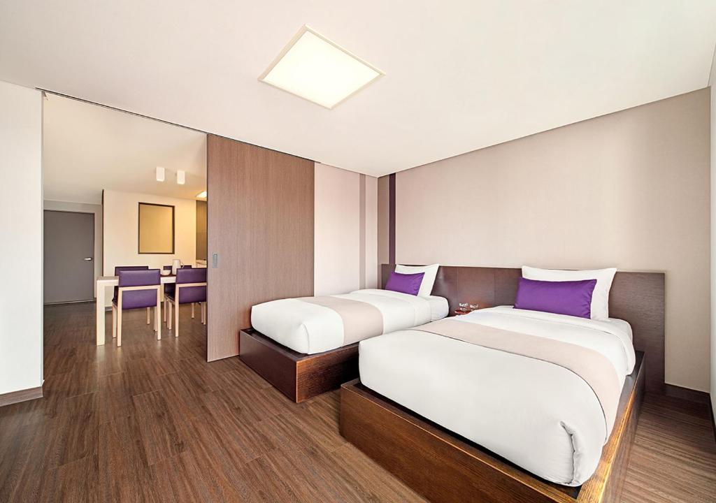 Katil atau katil-katil dalam bilik di Hanwha Resort Yongin Besancon