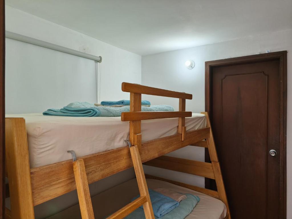 Postel nebo postele na pokoji v ubytování Kuyay Yachi Hostel