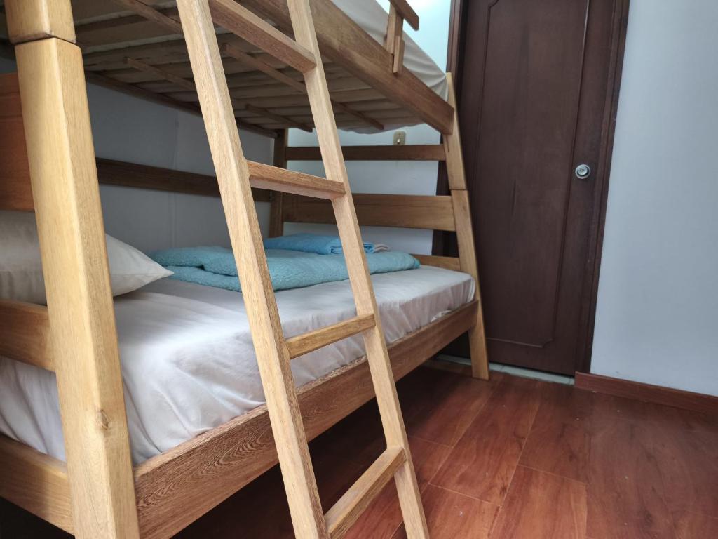 Postel nebo postele na pokoji v ubytování Kuyay Yachi Hostel