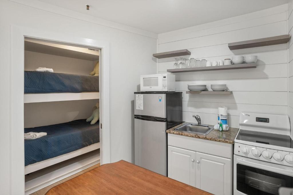 a small kitchen with a sink and a microwave at 529 Sunsuite in Fripp Island