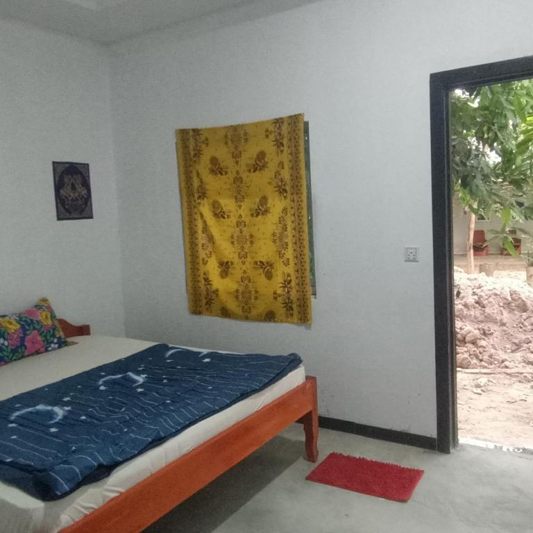 Postel nebo postele na pokoji v ubytování Phonluer Angkor Homestay,