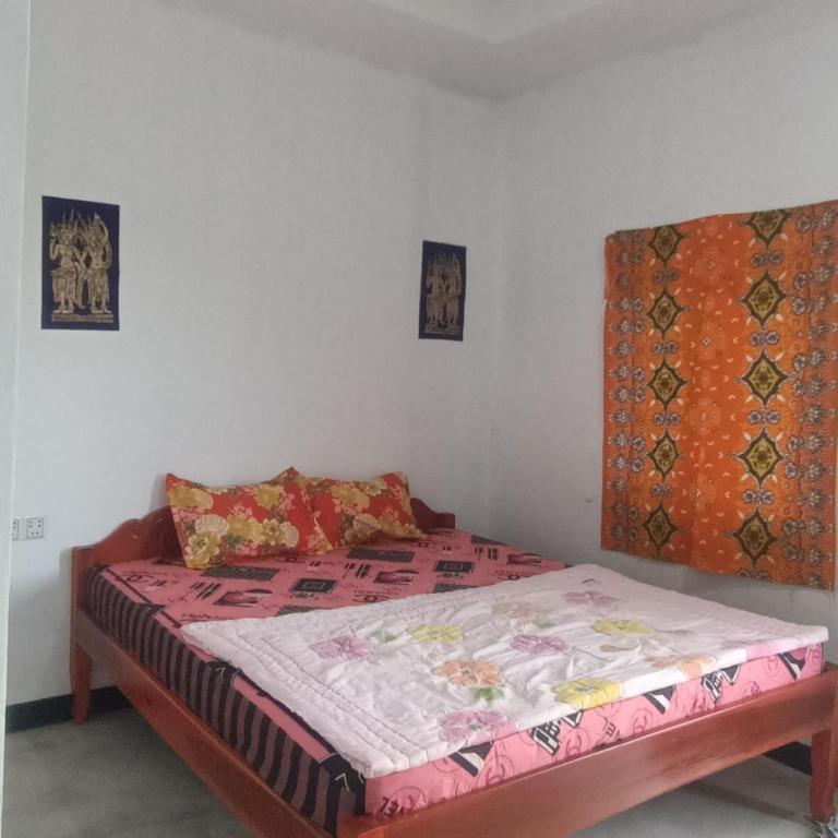 Postel nebo postele na pokoji v ubytování Phonluer Angkor Homestay,