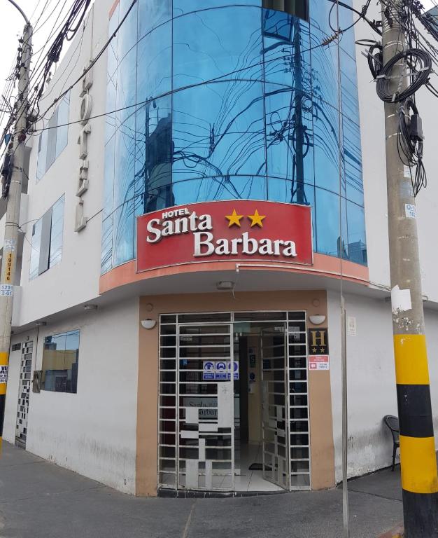a building with a sign that reads santa barbara at Hotel Santa Barbara ilo in Ilo